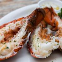 Grilled Maine Lobster Tail · 5 oz. Lobster tail grilled and served with herb butter and lemon.