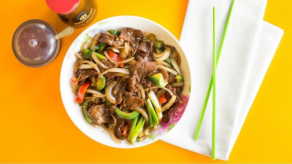 Mongolian Beef · Beef, white onion, green onion, and oyster sauce, served with steamed rice.