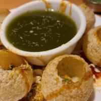 Pani Poori · Fried crisp puri filled with a mixture of flavored water.