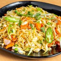 Chicken Noodles · Pan-fried seasoned Noodles tossed with marinated deep fried chicken and veggies.