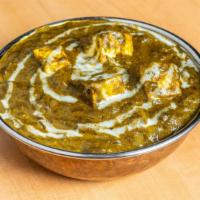 Palak Paneer · Homemade cheese cooked with spinach gravy.