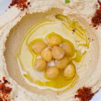 Hummus · Vegan and gluten-free. A delicate mixture of garbanzo beans blended with tahini, garlic, sal...