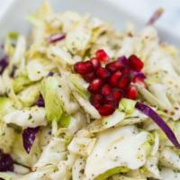 Cabbage Salad · Vegan and gluten-free. Sliced cabbage mixed with dry mint, garlic, lemon juice, vegetable oi...