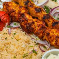 Combo Chicken Plate · One skewer of chicken lula and 5 pieces chicken breast with side of house made of garlic dip...