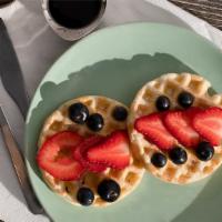 Sweet Waffles · Freshly made waffle, sprinkle of powdered sugar, side of maple syrup, and fresh strawberries...