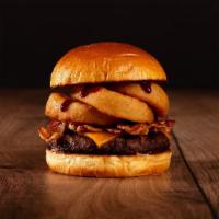 The Bacon Bbq Burger · Beef patty, bacon, fried onion rings, BBQ sauce, and melted cheddar cheese on a bun.