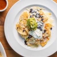 Cali Nachos · Choice of filling, homemade chips, beans, pico de gallo, melted mozzarella cheese, cream, fr...