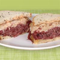 Corned Beef Reuben · Corned beef with sauerkraut, russian dressing and swiss cheese on your choice of bread.