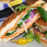 Roasted Turkey Panini · Roasted turkey, Swiss cheese, fresh tomato, spinach, and red onions and chipotle aioli on ci...