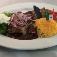 Enchilada De Mole · Our mole is a fusion of different chiles Mexican spices and hint of chocolate. Two chicken e...