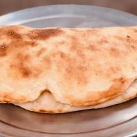 Miracle · Calzone filled with grilled chicken, cheese, onion, tomato, and parsley.