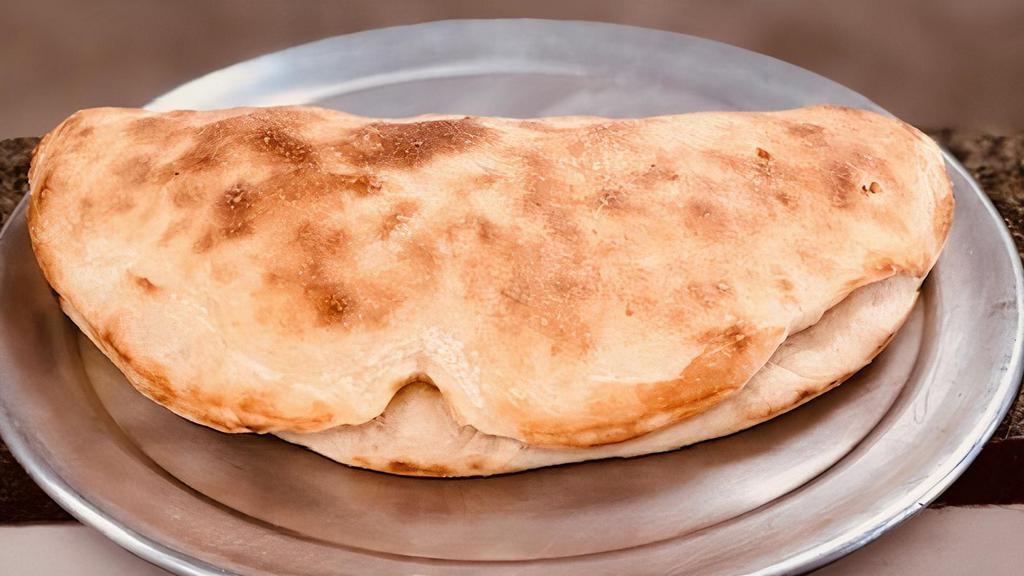 Miracle · Calzone filled with grilled chicken, cheese, onion, tomato, and parsley.