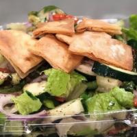 Fattoush Salad · Tomato, cucumber, green onion, lettuce, lemon juice, parsley, olive oil, and pita chips.