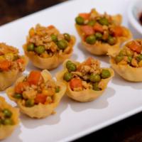Golden Cups · Light crispy flour sheets filled with a combination of ground corn, shrimp, chicken, and oni...