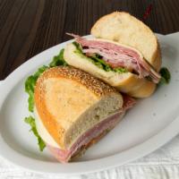 Italian · Genoa salami, ham, provolone cheese, Italian dressing, onion, lettuce and tomatoes.