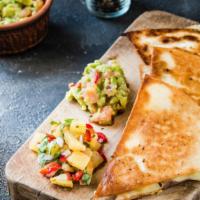 The Chicken & Bacon Quesadilla · Quesadilla made with Chicken, crispy bacon strips, melted cheese, green peppers, and red oni...
