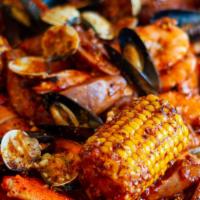 Waikiki Beach Combo (3-4 People) · 2 lobster tails , 2 clusters of snow crabs, 1 lb of shrimp, 3 corns, 5 potatoes, 6 sausages,...