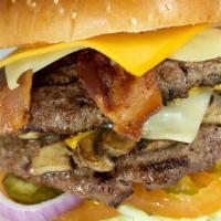 Monster Burger · 2 x 1/2 lb. Half pound patties, 2 slice of bacon, cheese and sauteed mushrooms. Served with ...