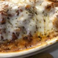 Homemade Baked Lasagna · Thick layers ricotta cheese, mozzarella cheese, aged Romano cheese, and tomato sauce baked w...