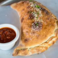 Cheese Calzone · Made from our hand made pizza dough and stuffed with mozzarella and ricotta cheese.