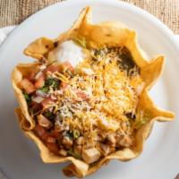Cabo Grande (Taco Salad) · Flour tortilla shell filled with your choice of charbroiled beef or chicken, mixed greens an...