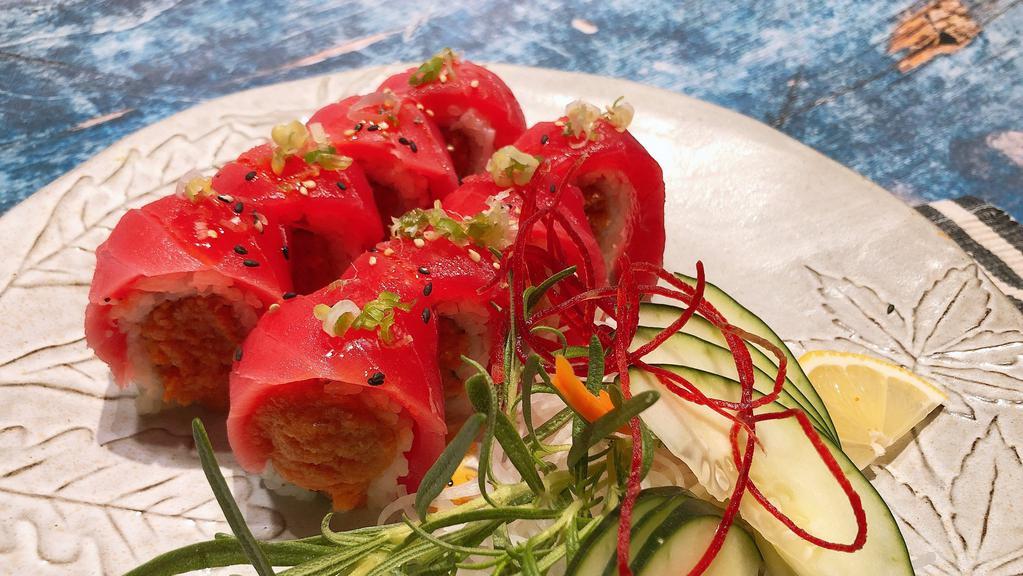 Hawaiian Roll · Spicy. Spicy tuna inside with tuna on top with chill oil, eel sauce and green onion.