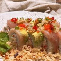 Fantasy Roll · Real crab, avocado and albacore topped with fried garlic, masago, red onion, Sriracha and sp...