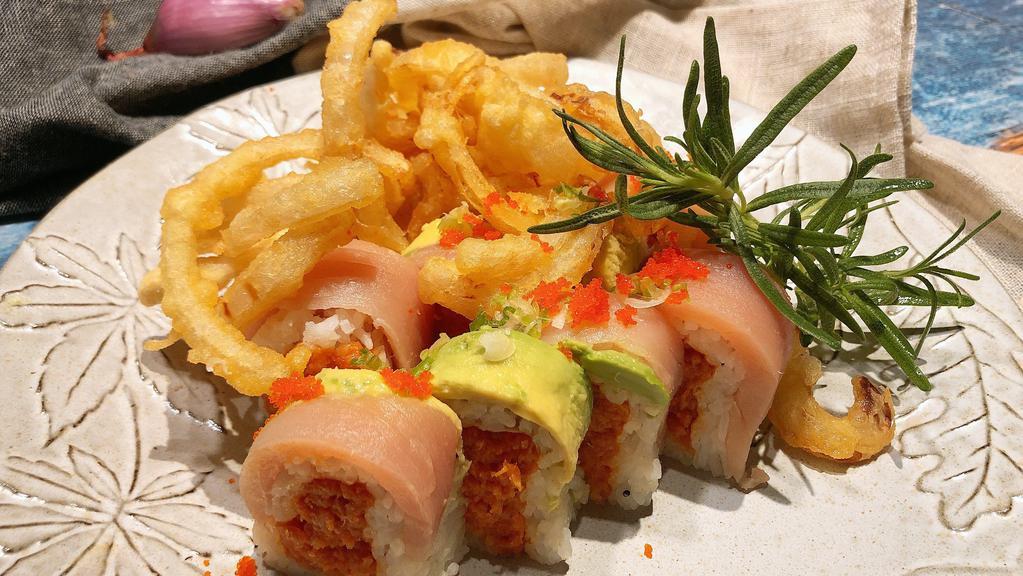 Blooming Onion Roll · Spicy. Spicy tuna inside with albacore and avocado on top with light may, house sauce, chili oil and deep fried onion on top.