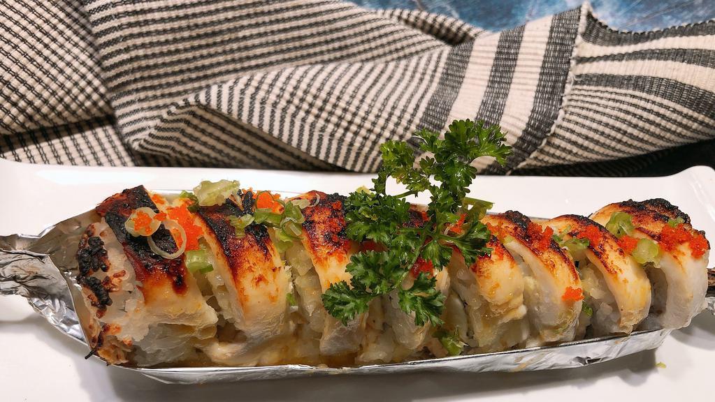 Snow Roll · Spicy. Baked crab, avocado, cream cheese inside with escolar on topping with masago, green onion and eel sauce.