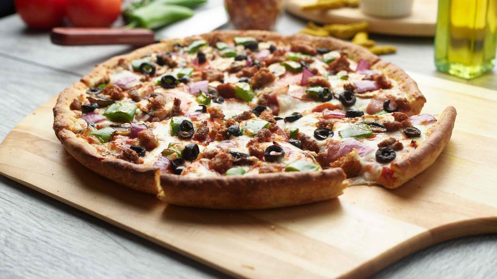 Combination Pizza · This Pizza has our signature red sauce, fresh diced mozzarella cheese, sliced pepperoni, sliced Canadian bacon, fresh mushrooms,  crisp red onions, sliced black olives, crisp bell pepper, juicy Italian sausage, and ground beef