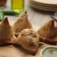 Samosa (2) · Our samosas are stuffed with potatoes, peas, and spices, and served with a side of our signa...