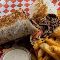 Beef Shawarma Wrap · Thinly sliced cuts of beef, tahini sauce, onion, parsley, tomato & pickles.
