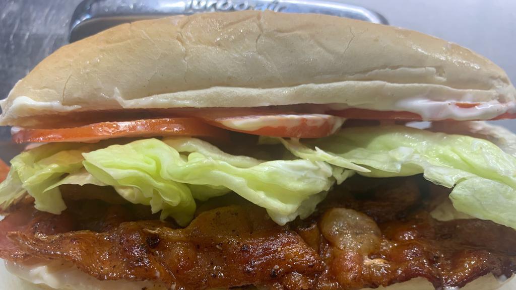 Becky'S Blt · Bacon, lettuce, tomato and mayo on a French roll.  Comes with fries or tots.