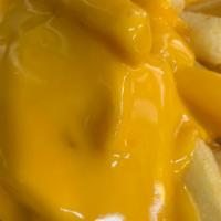 Cheese Fries  · Crispy fries topped with nacho cheese.