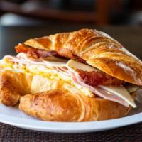 Ham, Bacon Egg & Cheese Sandwich · Thinly sliced Ham and crispy bacon, fried eggs, melted cheese on your choice of bread.