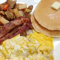 American Breakfast · 2 eggs of your choice, 2 pancakes, 2 bacon slices, and potatoes.