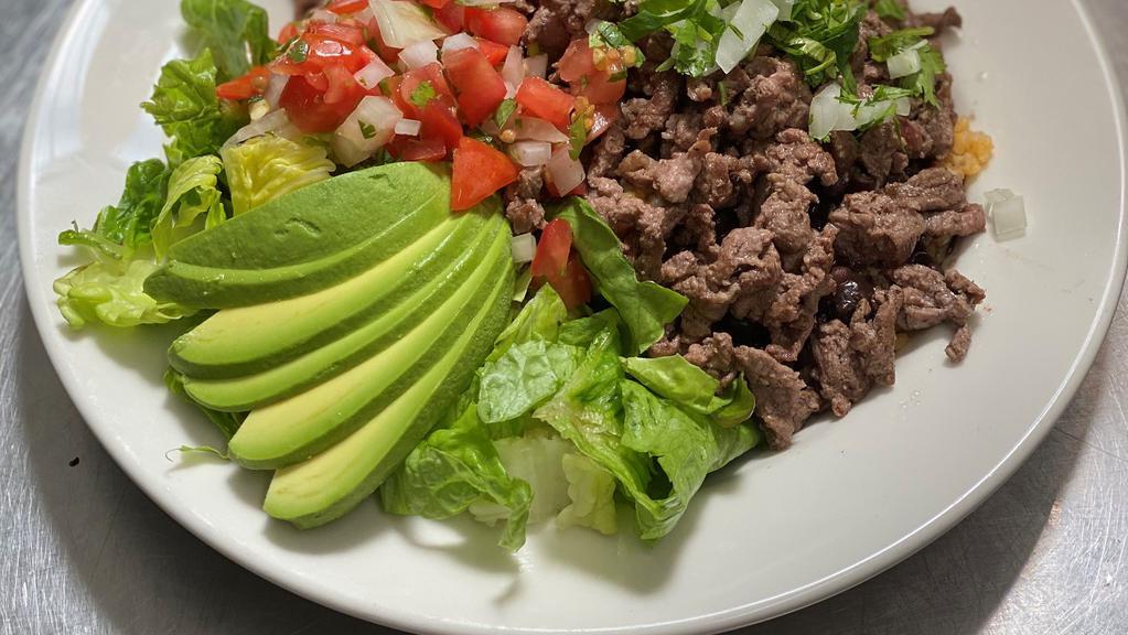 Latin Bowls · Choice of Protein, served with rice, black beans, lettuce, pico de gallo, and avocado in a bowl.