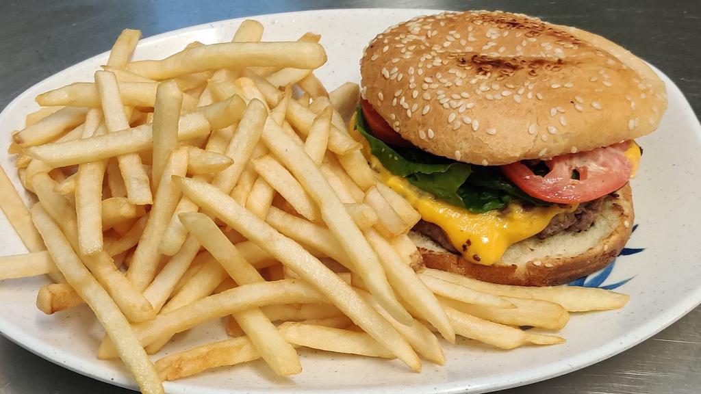 Hamburger · Beef patty, thousand island, lettuce, tomato and a side of fries with a free drink.