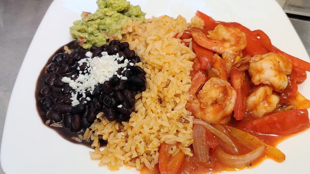 Shrimp Fajitas · Shrimp sautéed with bell peppers, onions, and tomatoes. Served with rice, beans, guacamole and tortillas.