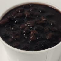 Black Beans · Black beans simmered for hours with spices and herbs.
