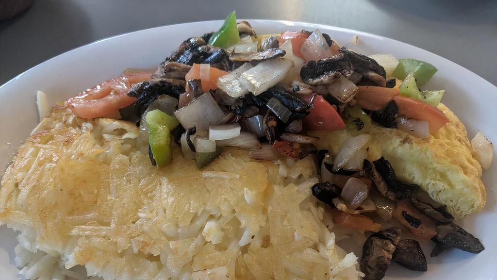Veggie Omelette · Tomato, bell pepper, onion and mushroom. Served with choice of hash browns or country fried potatoes and choice of toast or biscuit and gravy.
add cheese and spinach upon request
