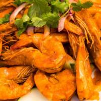 Camaron Tapatio · Head on shrimp sautéed on tapatio sauce.