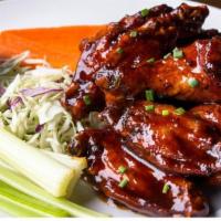 Chicken Wings · Choose from Guinness BBQ, buffalo, suicide habanero, sweet chili, sriracha bourbon. Served w...