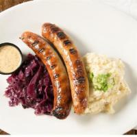 Guinness Bratwurst · Served with champ and bacon-braised red cabbage. With a side of Guinness Honey Mustard.