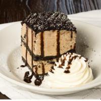 Mud Pie · Homemade coffee ice cream & oreo cookie layers. Drizzled with chocolate syrup & powdered sug...
