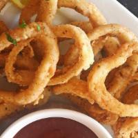 Fried Calamari · Crispy-Battered Calamari Rings Fried Perfectly to a Golden Brown Crunch Served with a side o...