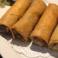 * Egg Rolls * · Vegan. Hand rolled lightly golden fried in spring roll paper wrapped with cabbage, mushrooms...