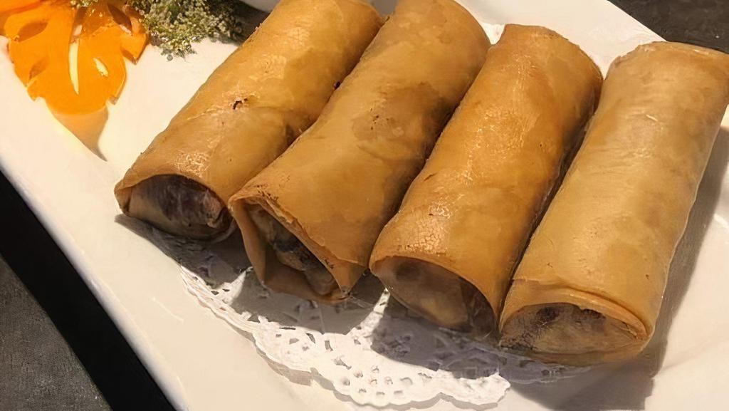 * Egg Rolls * · Vegan. Hand rolled lightly golden fried in spring roll paper wrapped with cabbage, mushrooms, sweet corn, carrots, and glass noodles served with our delicious  sweet chili sauce (4pcs).