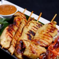 * Chicken Satay * · Spicy. Marinated grilled chicken on skewers with turmeric powder served  with our crafted  p...