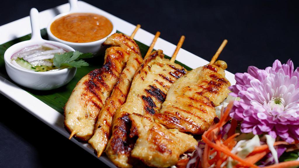 * Chicken Satay * · Spicy. Marinated grilled chicken on skewers with turmeric powder served  with our crafted  peanut sauce and cucumber sauce (4 skewers).